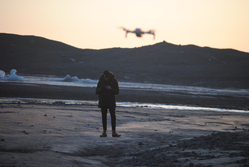 Portrait of man flying drone in Iceland (Digital)