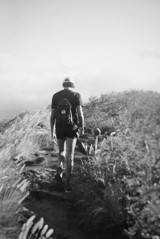 Black and white portrait of man hiking on mountain in Hawaii (Digital)
